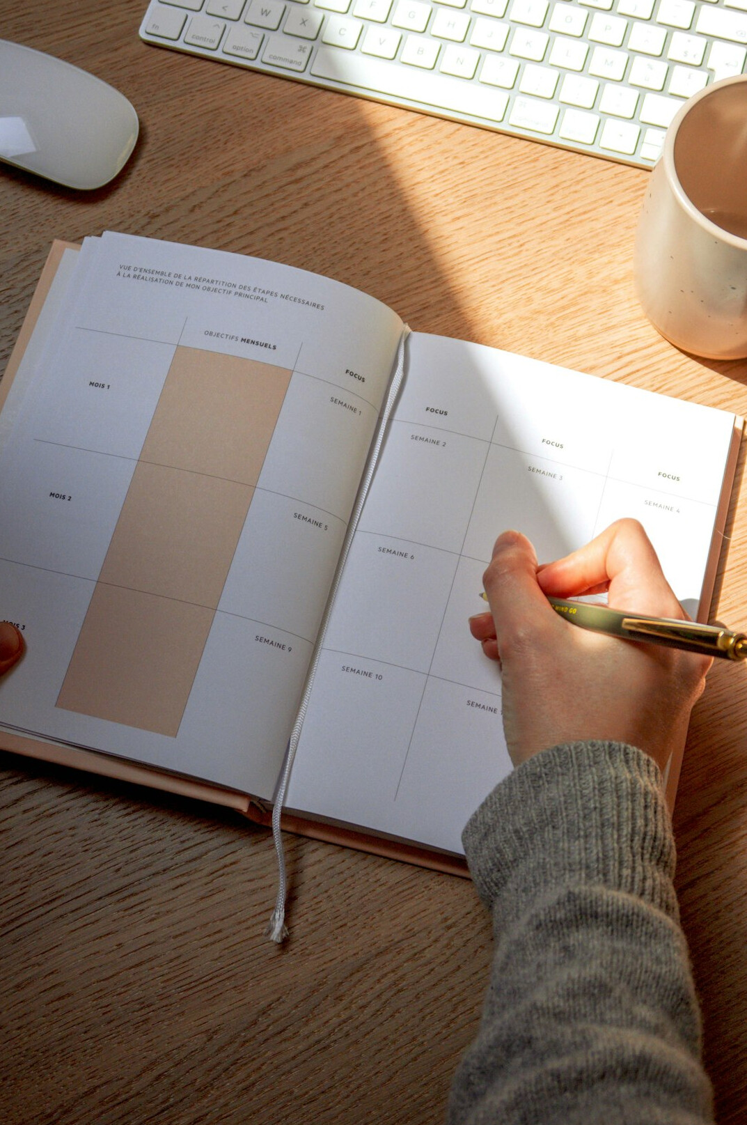 person creating household budget at desk