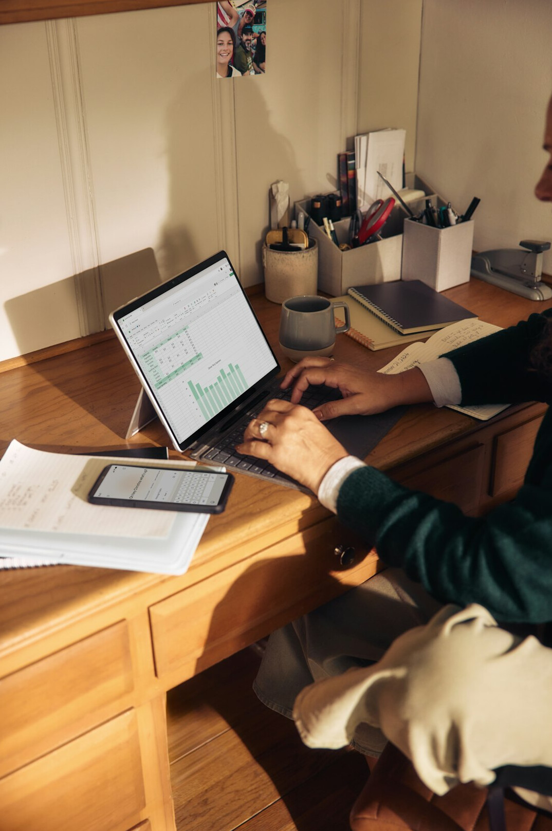 person creating household budget at desk