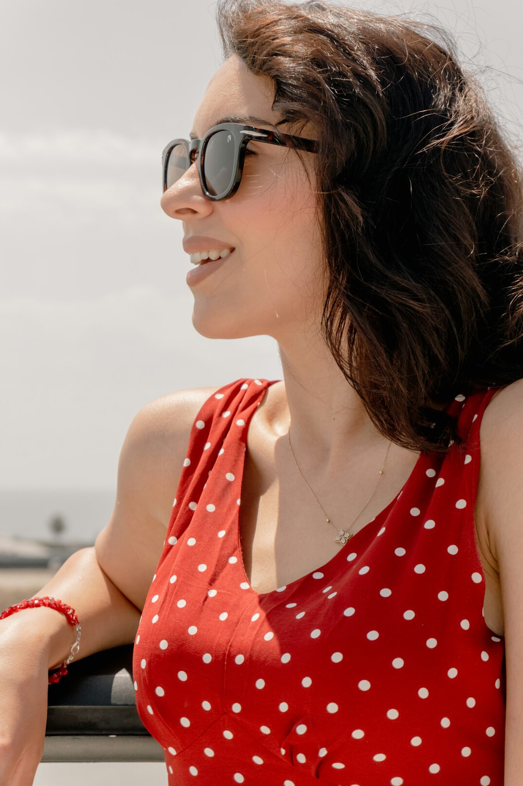 Portrait of a smiling Latin American woman in her thirties with dark hair