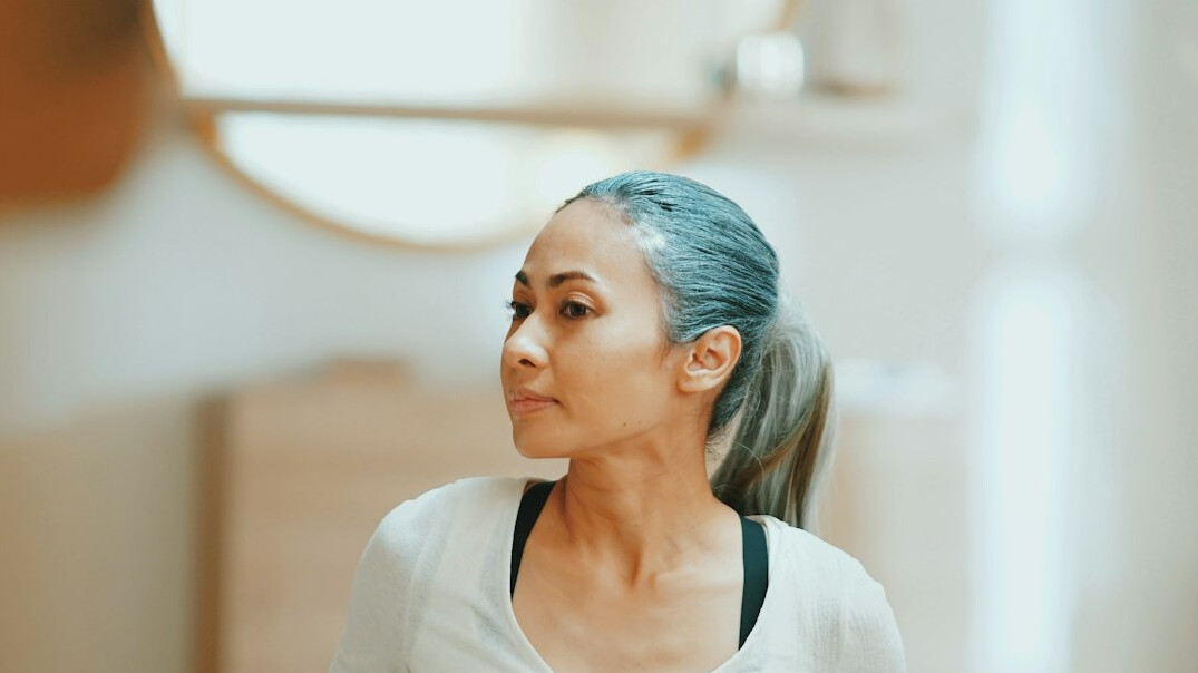 Portrait of a Latin American woman in her fifties with short grey hair